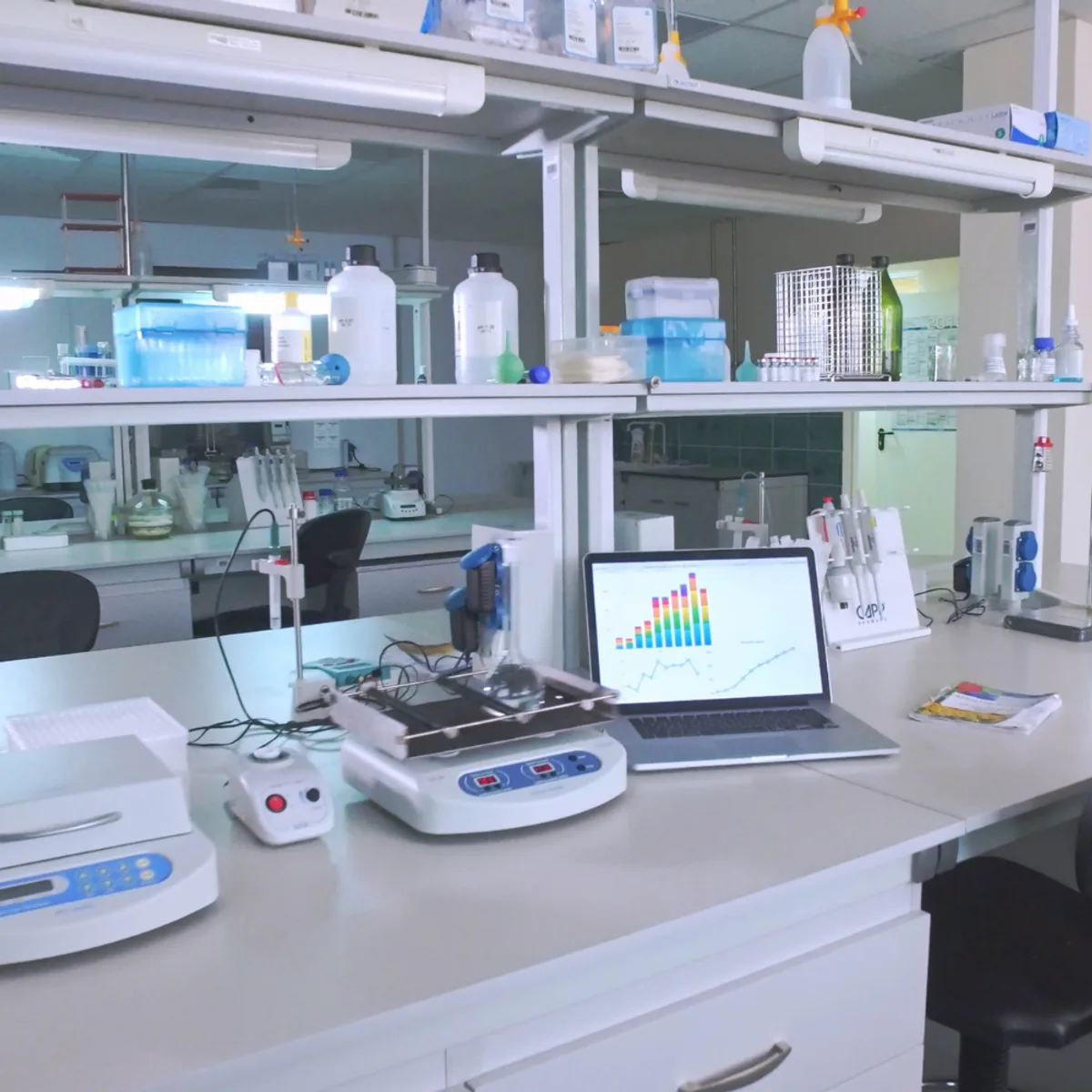 A laboratory bench with instruments and consumables